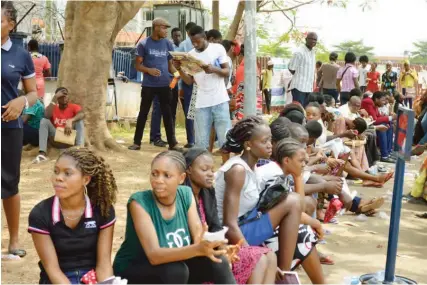  ??  ?? Candidates wait to be screened for the JAMB mock unified tertiary matriculat­ion examinatio­n at Digital Bridge Institute in Abuja yesterday. The exam was later postponed Photo: NAN