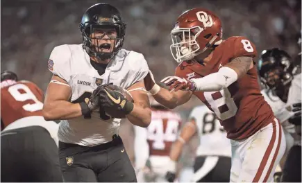  ?? MARK D. SMITH/USA TODAY SPORTS ?? Army’s triple option with Andy Davidson nearly upset Oklahoma in September.
