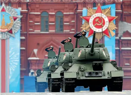  ?? AP ?? Soviet World War II vintage T-34 tanks roll in Red Square during the Victory Day military parade in Moscow.