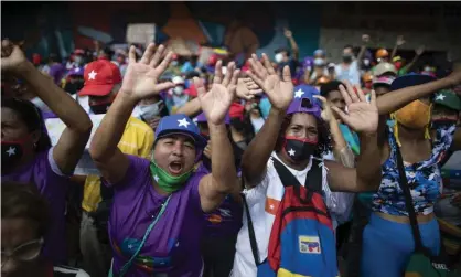  ?? Photograph: Ariana Cubillos/AP ?? Government supporters at a campaign rally in Caracas last week.