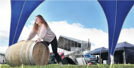  ?? PHOTO: PETER MCINTOSH ?? Ready to roll . . . Vault 21 event organiser Jess Brooks (23) sets up the student area for the Melbourne Cup Day at Wingatui.