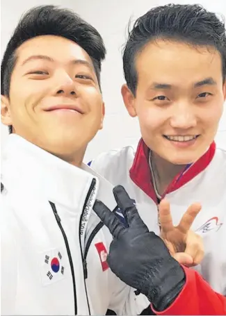  ?? Pictures / AP ?? Skaters Kam Alex Kang Chan (left) and Kim Ju Sik pose for a selfie before training this week.