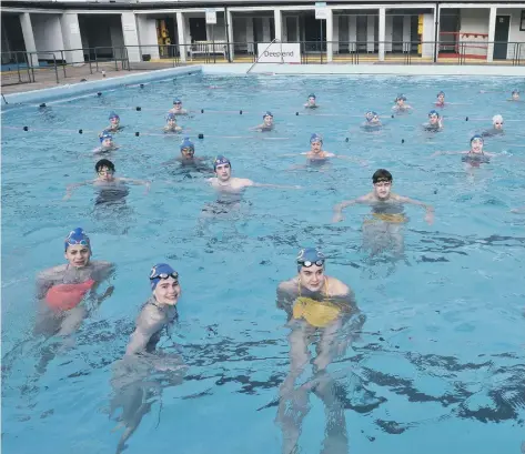  ??  ?? Distanced training for City of Peterborou­gh Swimming Club at the Lido early on Monday morning.