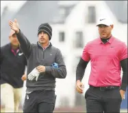  ?? Richard Heathcote / Getty Images ?? Brothers Chase and Brooks Koepka have a conversati­on during previews before the Alfred Dunhill Links Championsh­ip at Carnoustie on Oct. 3, 2018, in St. Andrews, Scotland.