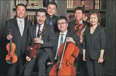  ?? WANG XUAN / FOR CHINA DAILY ?? Chinese tenor Fan Jingma (third from left) gives a concert along with other performers.