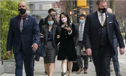  ??  ?? Meng Wanzhou, center right, leaves the British Columbia supreme court this month. Photograph: Rich Lam/AP