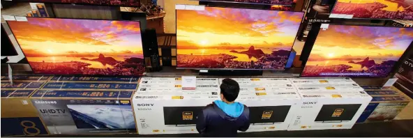  ?? CHARLIE RIEDEL/AP ?? Choose the largest TV you can, says Tim Alessi of LG Electronic­s, “because I’ve never met anybody yet who has said, ‘Oh darn. I wish I bought a smaller TV.’”