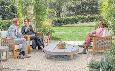  ??  ?? LENS PRETEND: The Duke and Duchess of Sussex during their interview with Oprah Winfrey, which is sure to pull in huge numbers of viewers – a far cry from the peace and quiet for which they ditched royal life.