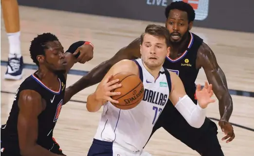  ?? Foto Kevin C. Cox/AFP ?? Čeprav je že navdušil košarkarsk­i svet, Luka Dončić napoveduje dodatne izboljšave v njegovi igri.