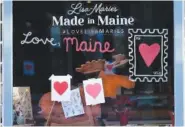  ?? AP PHOTO/ROBERT F. BUKATY ?? Valentine’s Day hearts decorate a shop Wednesday in Portland, Maine.