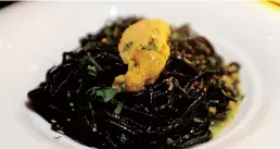  ??  ?? Black ink spaghetti with sea urchin