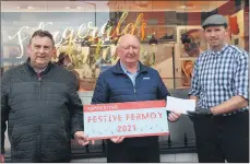  ?? (Photo: Katie Glavin) ?? Noel McCarthy and Jimmy Corcoran of the Fermoy Christmas Lights Committee, pictured with Barry Fitzgerald of Fitzgerald’s Butchers who supported this year’s Christmas lights appeal.