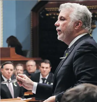  ?? JA C Q U E S B O I S S I NO T/ T H E C A NA D I A N P R E S S ?? Quebec Premier Philippe Couillard answers questions in the legislatur­e Tuesday. He said his government won’t make the same mistake as the PQ did with its defunct charter of values.