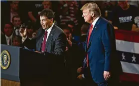  ?? Mandel Ngan / AFP / Getty Images ?? Republican congressio­nal candidate Troy Balderson, left, speaks next to President Donald Trump during a rally Saturday in Lewis Center, Ohio.