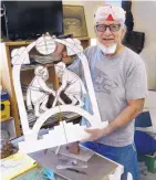  ?? GREG SORBER/JOURNAL ?? Upton Ethelbah Jr. holds a cardboard template for his Santa Clara Pueblo ram dancers.