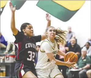  ?? Chris Torres/ The Signal ?? Canyon guard Josie Regez (23) drives for a layup during the fourth quarter of Thursday’s CIF Southern Section Division 2AA first-round matchup against the Covina Colts at Canyon High School.