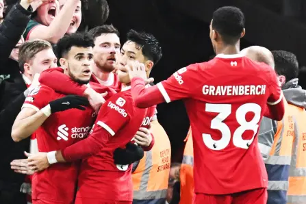  ?? — AFP photo ?? Liverpool’s midfielder Diaz (left) celebrates after scoring his team third goal during the English Premier League match against Luton Town at Anfield in Liverpool, north west England.