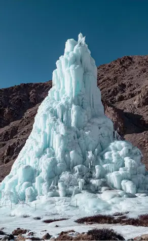  ??  ?? An ice stupa made in the 2019-20 winter by the villagers of Phyang during the 2020 Ice Stupa Competitio­n, an initiative to spread the art of glacier grafting. The ice stupa is 26m high and stores an estimated seven million litres of water. Phyang was also the site of the first full-scale ice stupa in 2014-15. The Rinpoche (head lama) of Phyang Monastery donated 180 acres of barren village land to establish a university for mountain youth, HIAL (Himalayan Institute of Alternativ­es, Ladakh), with the purpose of fusing indigenous ideas with modern technology.