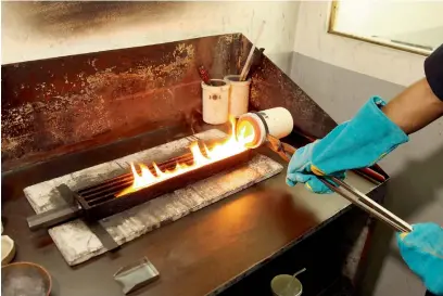  ??  ?? MOLTEN MAGIC: Gold bars melted into liquid gold is poured into different bar-shaped moulds, to be further shaped into jewellery.