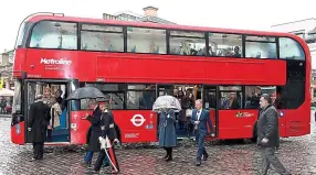  ?? REUTERS ?? Heir fare: Prince Charles and Duchess of Cornwall with an London electric bus