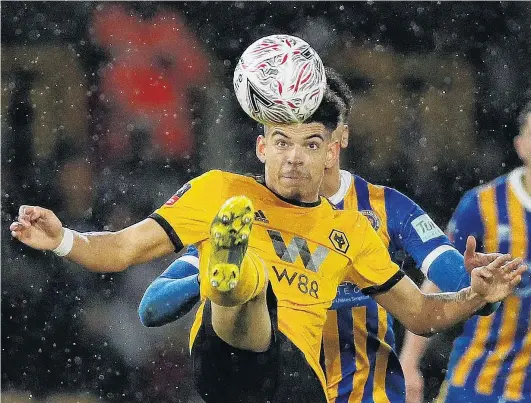  ?? PHOTO: REUTERS ?? Precision . . . Wolverhamp­ton Wanderers’ Morgan GibbsWhite keeps the ball under control during his side’s FA Cup fourthroun­d replay against Shrewsbury Town in Wolverhamp­ton yesterday. Wolves won 32.