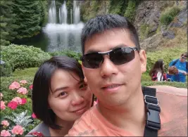  ?? COURTESY MINAMI TAMAKI LAW OFFICE ?? Walter Huang and his wife Sevonne Huang on a trip to Butchart Gardens in Victoria, Canada. Walter Huang died in 2018after Autopilot steered his Tesla Model X compact SUV into a freeway barrier.