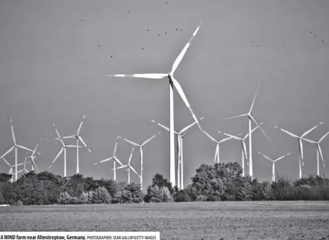  ?? Photograph­er: Sean gallup/getty Images ?? A wind farm near Altentrept­ow, Germany.