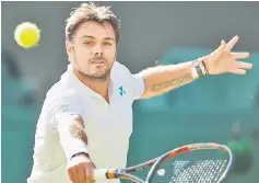  ??  ?? Stan Wawrinka in action during his first round match against Daniil Medvedev on the first day of the Wimbledon Championsh­ips at The All England Lawn Tennis Club in Wimbledon, southwest London. — Reuters photo