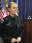  ?? JULIET LINDERMAN — THE ASSOCIATED PRESS FILE ?? File-This file photo shows Officer Hannah Parish displaying a Taser Internatio­nal Axon Camera body camera during a news conference in Baltimore.