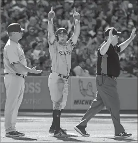  ?? FRED THORNHILL/THE CANADIAN PRESS/AP PHOTO ?? The Yankees’ Brett Gardner gestures to his dugout after hitting a triple during the third inning of Saturday’s game against the Blue Jays in Toronto. The Yankees won, 8-5.