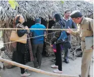  ??  ?? Police and forensic experts inspect the site where a woman was gang raped in Subalpur, India, on Jan. 25. A crowd of 300 people watched the woman’s trial on Jan. 20, and at
least one captured the proceeding­s on video.