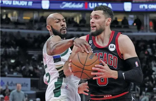  ?? CHARLES REX ARBOGAST/AP ?? Zach LaVine drives to the basket under pressure from the Bucks’ Jevon Carter on Thursday night as the Bulls again failed to turn things around.