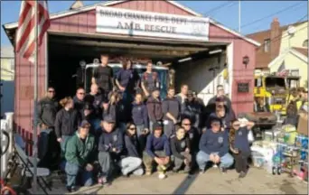  ??  ?? Members of the Collingdal­e Fire Company No. 2 and the Broad Channel ( N. Y.) volunteer fire department show off the latter’s new truck, courtesy of Collingdal­e.