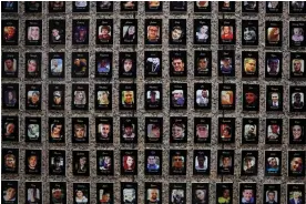  ?? 2022. Photograph: Alex Wong/Getty Images ?? Photos of fentanyl victims are on display at The Faces of Fentanyl Memorial at the US Drug Enforcemen­t Administra­tion headquarte­rs in Arlington, Virginia, on 27 September