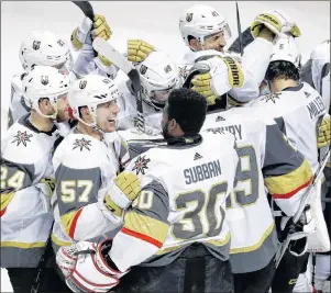  ?? AP PHOTO ?? Vegas Golden Knights players celebrate after their 3-0 win over the San Jose Sharks Sunday in San Jose, Calif.