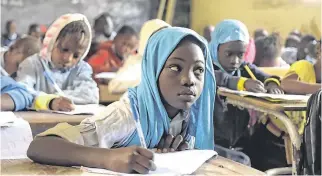  ?? PHOTO: SEYLLOU/AFP/ GETTY IMAGES ?? Keen to learn: Pupils at a primary school in Pikine, Dakar, Senegal.