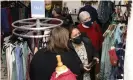  ?? Susan Moran/AP ?? Customers shopping for athleisure clothing during the Covid pandemic. Photograph: