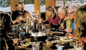  ?? ?? Dining at Red Mountain Alpine Lodge, last April, one of the luxurious chalet-style huts along the route, tucked away from a road just enough to feel secluded, in the San Juan Mountains.