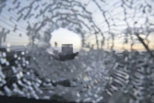 ??  ?? A building is seen through a bullet hole in a window of the Africa Hotel in the town of Shire, Tigray region, Ethiopia, March 16, 2021.