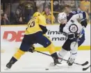  ?? The Associated Press ?? Winnipeg Jets centre Mark Scheifele, seen here in action against P.K. Subban of the Nashville Predators, will miss six-to-eight weeks with an upper-body injury.