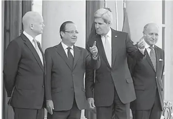  ?? ASSOCIATED PRESS ?? From left, British Foreign Secretary William Hague, French President Francois Hollande, US Secretary of State John Kerry and French Foreign Minister Laurent Fabius pose upon their arrival at the Elysse Palace in Paris, prior to a meeting on Syria.