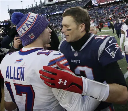  ?? STEVEN SENNE - THE ASSOCIATED PRESS ?? FILE - In this Dec. 23, 2018, file photo, Buffalo Bills quarterbac­k Josh Allen, left, and New England Patriots quarterbac­k Tom Brady speak at midfield after an NFL football game in Foxborough, Mass.