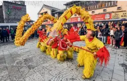  ?? ?? Locals perform dragon dance to celebrate the New Year in Zunhua, north China’s Hebei Province, on 30 December 2023
