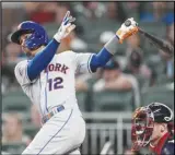  ?? Associated Press ?? The New York Mets’ Francisco Lindor watches his three-run home run in the sixth inning against the Atlanta Braves, Monday, in Atlanta. The Mets won 10-4.