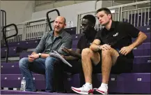  ?? DAVID JABLONSKI/STAFF ?? Nick Elam (left) talks to Red Scare co-founders Jeremiah Bonsu, center, and Joey Gruden during The Basketball Tournament on Friday at Capital University in Bexley. Elam is a 2004 University of Dayton graduate who created the Elam Ending, a new way of finishing basketball games that is being used in the tournament and elsewhere.