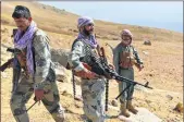  ?? -AFP ?? Afghan resistance movement and anti-Taliban uprising forces patrol on a hilltop in Anaba district, Panjshir province on Wednesday.