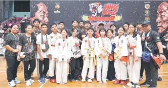  ?? — Bernama photo ?? Leonel Bellvin (front row, fifth right) with teammates and officials at the tournament.