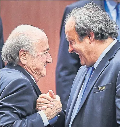  ??  ?? Then-Fifa president Sepp Blatter, left, and then-Uefa chief Michel Platini meet in 2015.