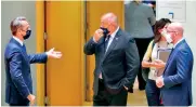  ??  ?? From left: Greece’s Prime Minister Kyriakos Mitsotakis, Bulgarian Prime Minister Boyko Borisov and European Council President Charles Michel gesture at the start of the summit in European Council headquarte­rs in Brussels