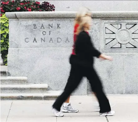  ?? CHRIS ROUSSAKIS/FILES ?? With Canada among the world’s strongest economies, markets are betting the Bank of Canada will increase the interest rate Wednesday. The bank will also unveil its inflation and growth outlook.